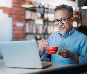 man planning for business while drinking coffee